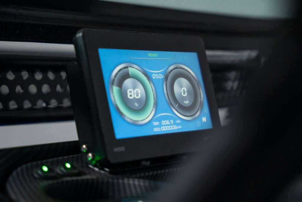A digital screen displaying car climate control settings.