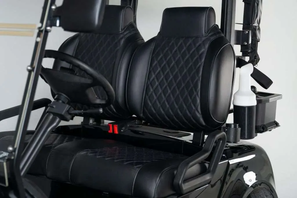 Luxurious black leather car seats with diamond stitching.