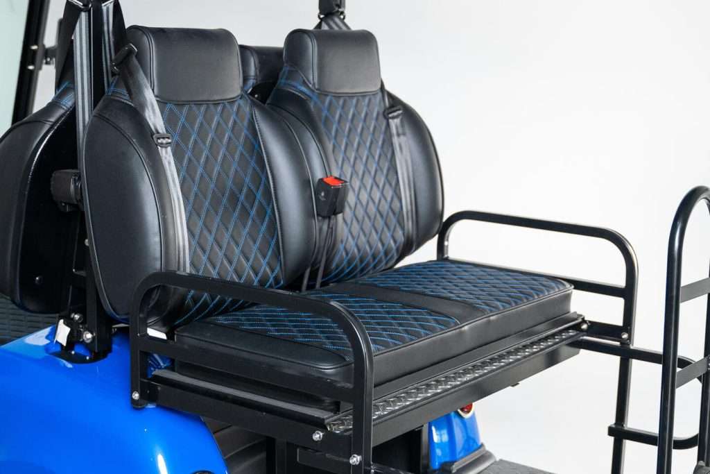 Black leather wheelchair seat with diamond stitching and armrests.