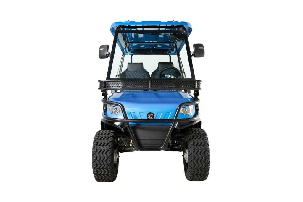 Front view of a blue all-terrain vehicle with large tires and a canopy.