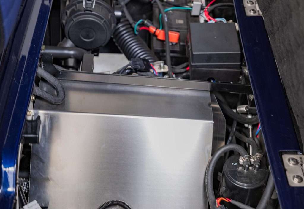 Close-up of an electric wheelchair motor and battery system.