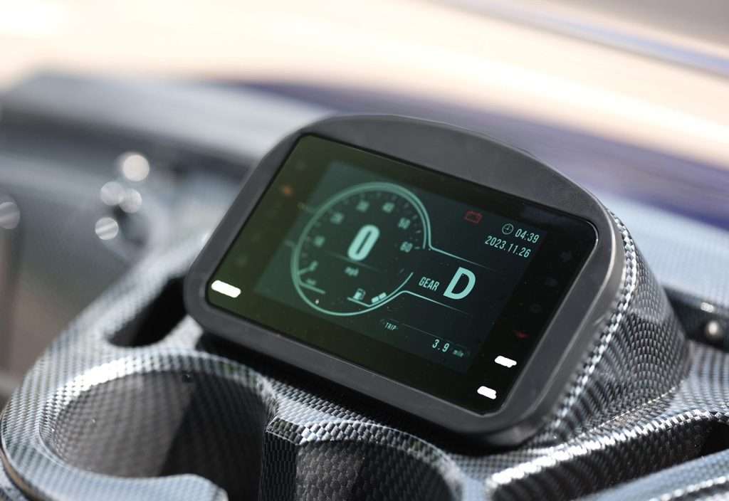 Digital car dashboard showing speed and gear in a sleek design.