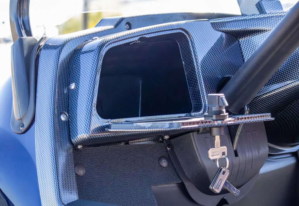 Close-up of a vintage car's rear window and part of the body.