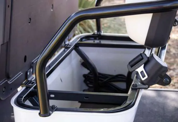Close-up of a roll cage inside a vehicle's interior.