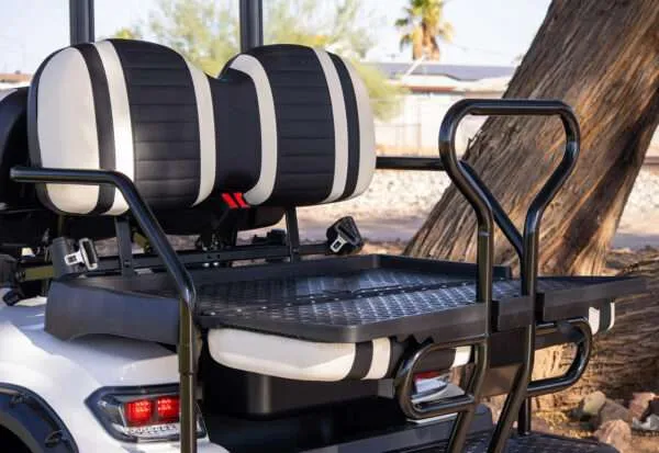 Large drum speakers mounted on a vehicle seat.