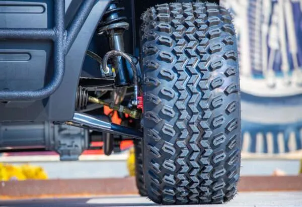 Close-up of an off-road tire and suspension system.