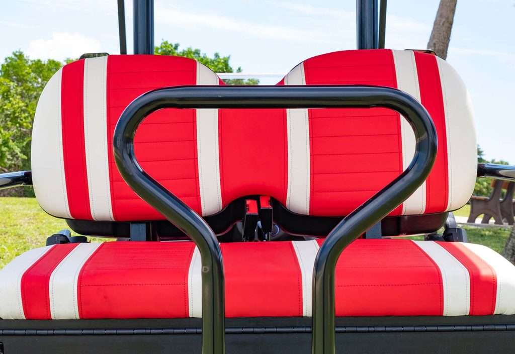 Red and white striped seats with black metal handles.
