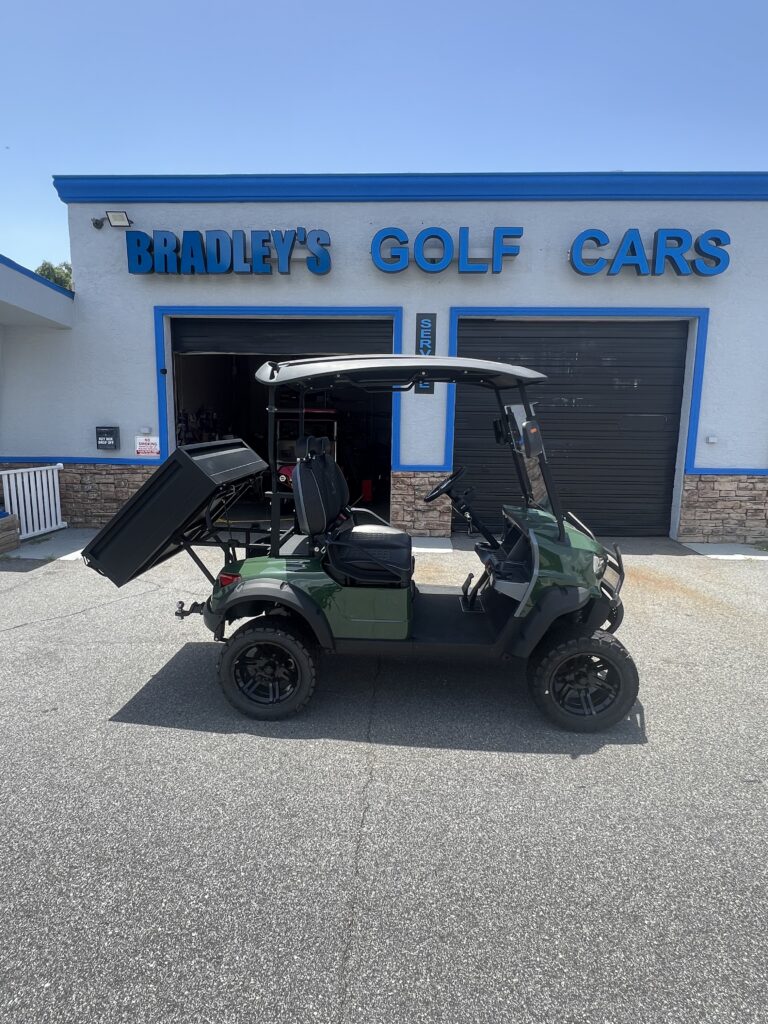 Camo utility golf cart parked outside Bradley's